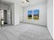 A bright bedroom features neutral carpeting and double windows that let in lots of light at 5013 Crandon Rd, Fort Mill, SC 29707