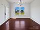 The dining area has a modern chandelier and an exit door to the exterior at 5013 Crandon Rd, Fort Mill, SC 29707