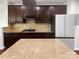This spacious kitchen offers dark wood cabinetry and granite countertops with stainless steel appliances at 5013 Crandon Rd, Fort Mill, SC 29707