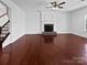 Spacious living room featuring a fireplace, hardwood floors and neutral paint at 5013 Crandon Rd, Fort Mill, SC 29707