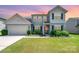 Charming two-story home with well-manicured lawn and inviting curb appeal in a desirable neighborhood at 5079 Nighthawk Dr, Fort Mill, SC 29707