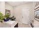 Well-lit mudroom featuring granite countertops, tiled flooring, and convenient access to the exterior, offering both style and functionality at 5079 Nighthawk Dr, Fort Mill, SC 29707