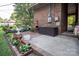 A charming brick patio is adorned with flower beds and outdoor decor, ready for relaxation at 5329 E Highway 27 Hwy, Iron Station, NC 28080