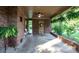 Covered back porch featuring brick detail, a ceiling fan, and space for outdoor seating at 5329 E Highway 27 Hwy, Iron Station, NC 28080