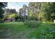 Sprawling backyard with garden plot and exterior of home visible at 5329 E Highway 27 Hwy, Iron Station, NC 28080