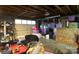 Unfinished basement with exposed ceiling, packed full of stored items at 5329 E Highway 27 Hwy, Iron Station, NC 28080