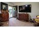 Open entryway with a modern TV, carved wooden dresser, and decorated with lion statues at 5329 E Highway 27 Hwy, Iron Station, NC 28080