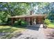 Charming brick home with a covered entryway, mature landscaping, and a long driveway at 5329 E Highway 27 Hwy, Iron Station, NC 28080