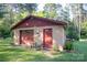 Garage exterior with covered grill and manicured lawn at 5329 E Highway 27 Hwy, Iron Station, NC 28080