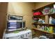 Practical utility room with shelves, microwave, and washer/dryer hookups for convenience at 5329 E Highway 27 Hwy, Iron Station, NC 28080