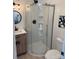 Bathroom featuring a glass-enclosed shower with white subway tile, modern vanity, and fixtures at 5420 Gwynne Ave # 21, Charlotte, NC 28205