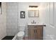 Stylishly updated bathroom featuring modern fixtures and a tiled walk-in shower at 5420 Gwynne Ave # 21, Charlotte, NC 28205
