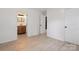 Spacious bedroom showcasing the natural light and access to the en-suite bathroom at 5420 Gwynne Ave # 21, Charlotte, NC 28205