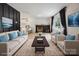 Staged living room features modern fireplace, hardwood floors, large window, and furniture at 5420 Gwynne Ave # 21, Charlotte, NC 28205