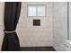 Shower with tiled walls and modern fixtures showcasing design and function at 5420 Gwynne Ave # 21, Charlotte, NC 28205