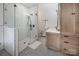 Modern bathroom equipped with a glass-enclosed shower, a sleek vanity, and stylish tile work at 594 Patterson Farm Rd, Mooresville, NC 28115