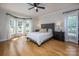 Bright bedroom with bay window, hardwood floors, and neutral decor offers a calming retreat at 594 Patterson Farm Rd, Mooresville, NC 28115