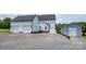 Home's exterior includes a two-car garage and gravel driveway at 594 Patterson Farm Rd, Mooresville, NC 28115