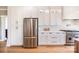 Well-appointed kitchen featuring stainless steel appliances, white cabinets, and hardwood floors at 594 Patterson Farm Rd, Mooresville, NC 28115