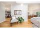 Open-concept living space with hardwood floors leading to a dining area and gourmet kitchen at 594 Patterson Farm Rd, Mooresville, NC 28115