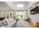 Bright living room with a large window, high ceilings, modern decor and view of the green yard at 594 Patterson Farm Rd, Mooresville, NC 28115
