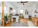Bright office with a large desk, plants, and natural light from many windows at 594 Patterson Farm Rd, Mooresville, NC 28115