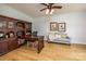 Charming office features built in cabinets, desk and sitting area near crown moulding at 594 Patterson Farm Rd, Mooresville, NC 28115