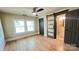 Light-filled bedroom with modern ceiling fan and private access to updated bathroom at 616 W Marion St, Shelby, NC 28150