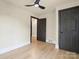 A bedroom with wood floors, black doors and trim, and a modern ceiling fan at 616 W Marion St, Shelby, NC 28150