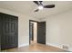 A bedroom with wood floors, black trim and doors, and a modern ceiling fan at 616 W Marion St, Shelby, NC 28150