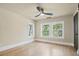 Bright bedroom featuring light wood floors and large windows overlooking trees at 616 W Marion St, Shelby, NC 28150