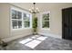 Dining Room filled with sunlight, large windows and a modern chandelier at 616 W Marion St, Shelby, NC 28150