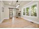 Dining room featuring sliding barn doors, hardwood floors, and natural light at 616 W Marion St, Shelby, NC 28150