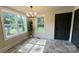 Bright dining room features large windows and a modern chandelier at 616 W Marion St, Shelby, NC 28150