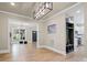 Open entryway with hardwood floors, built-in shelving, and natural light at 616 W Marion St, Shelby, NC 28150