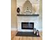 Living area boasts an electric fireplace with light brick surround and modern hearth at 616 W Marion St, Shelby, NC 28150