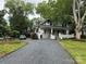 Charming two-story home with a black gravel driveway and inviting front porch at 616 W Marion St, Shelby, NC 28150
