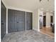 Hallway with gray doors, closet and access to the kitchen, with stainless steel appliances at 616 W Marion St, Shelby, NC 28150