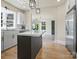 Kitchen view featuring an island with marble countertops, gold hardware, and stainless steel appliances at 616 W Marion St, Shelby, NC 28150