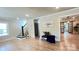 Open-concept living room showcases hardwood floors and seamless flow to dining area at 616 W Marion St, Shelby, NC 28150