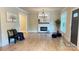 Bright living room featuring a modern fireplace, wood floors, and an elegant chandelier at 616 W Marion St, Shelby, NC 28150