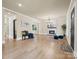Open-concept living room with fireplace, hardwood floors, and modern finishes at 616 W Marion St, Shelby, NC 28150