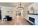 Bright and open living space featuring a fireplace and seamless flow to other rooms at 616 W Marion St, Shelby, NC 28150