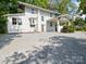 Two-story home featuring an attached carport and large windows at 616 W Marion St, Shelby, NC 28150