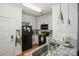 Bright kitchen features granite countertops, stainless steel sink, and modern appliances at 630 Calvert St # 410, Charlotte, NC 28208