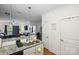 Open-concept kitchen featuring granite counters, stainless steel sink, and access to the living area at 630 Calvert St # 410, Charlotte, NC 28208