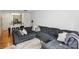 Spacious living room with a large sectional sofa and a view into the adjacent kitchen at 630 Calvert St # 410, Charlotte, NC 28208