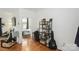 Bright living room with hardwood floors and an open doorway to the bedroom, providing a cozy and inviting atmosphere at 630 Calvert St # 410, Charlotte, NC 28208