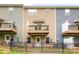 Backyard view of townhomes, each with a private balcony, patio, and fenced yard at 6507 Revolutionary Trl, Charlotte, NC 28217