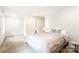Light-filled bedroom with ensuite bathroom, neutral colors, and plush carpeting at 6507 Revolutionary Trl, Charlotte, NC 28217